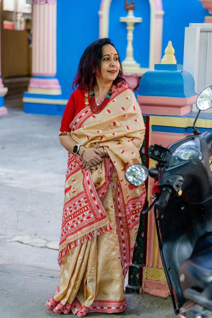 Traditional Assam Tussar Silk Saree with Red Border & Woven Motifs