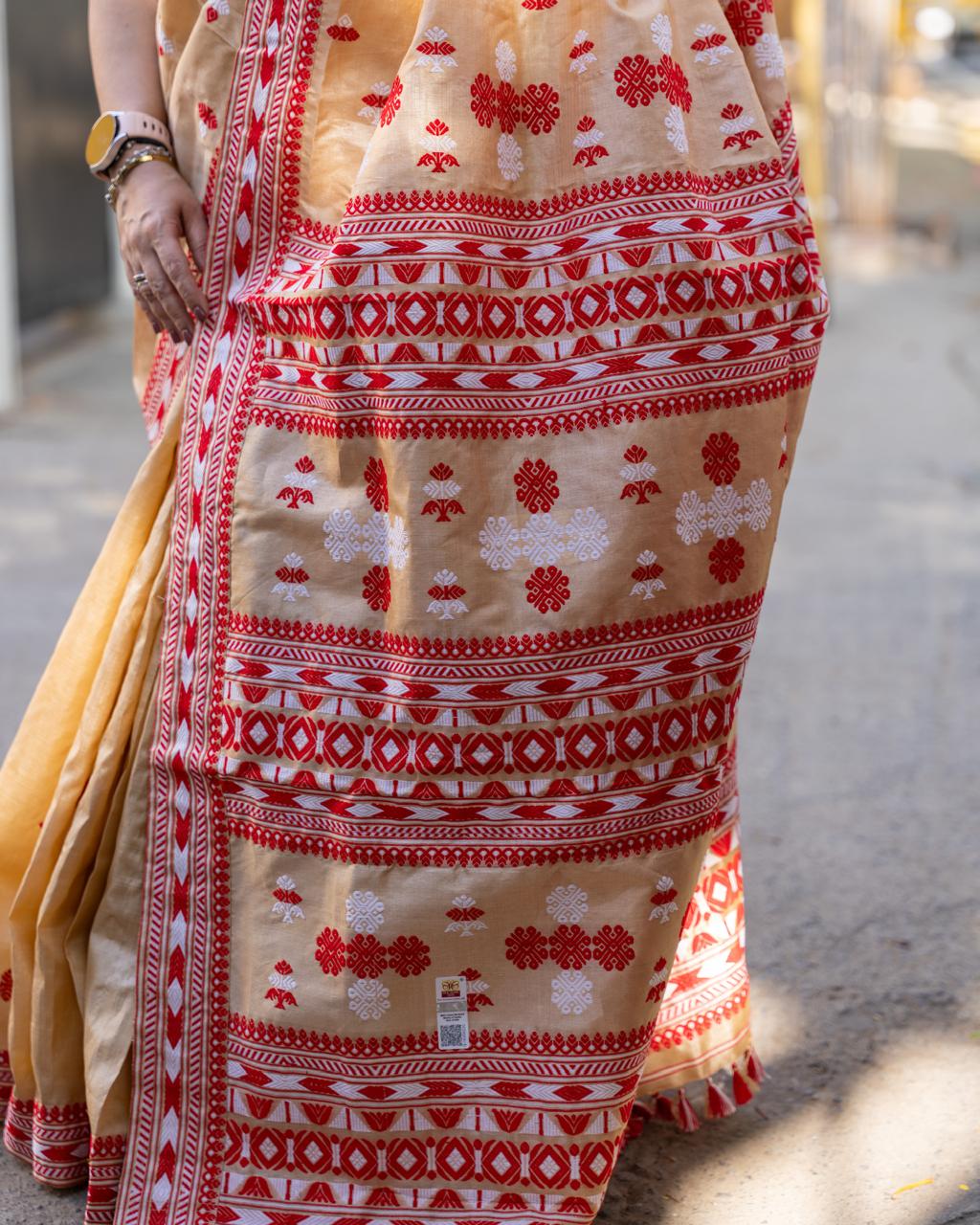 Traditional Assam Tussar Silk Saree with Red Border & Woven Motifs
